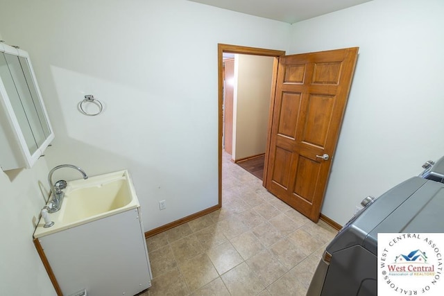 bathroom with vanity and baseboards