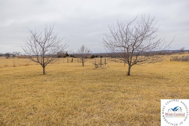 view of yard with a rural view