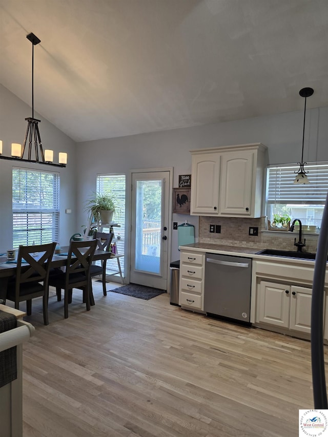 1010 NW Scenic Dr, Grain Valley, MO 64029 - kitchen featuring dishwasher, light wood-style floors, white cabinets, lofted ceiling, and healthy amount of natural light