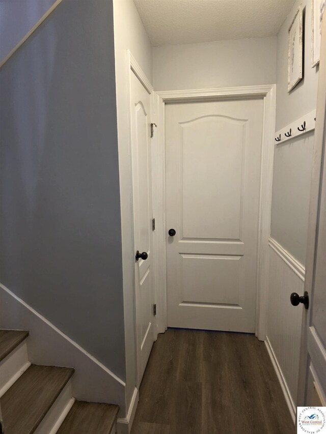 1010 NW Scenic Dr, Grain Valley, MO 64029 - hall featuring dark wood-style flooring and stairway