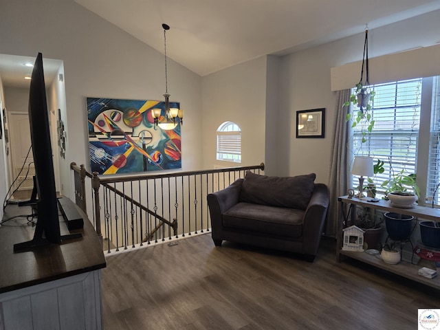 1010 NW Scenic Dr, Grain Valley, MO 64029 - living area with dark wood-style flooring, vaulted ceiling, a chandelier, and an upstairs landing