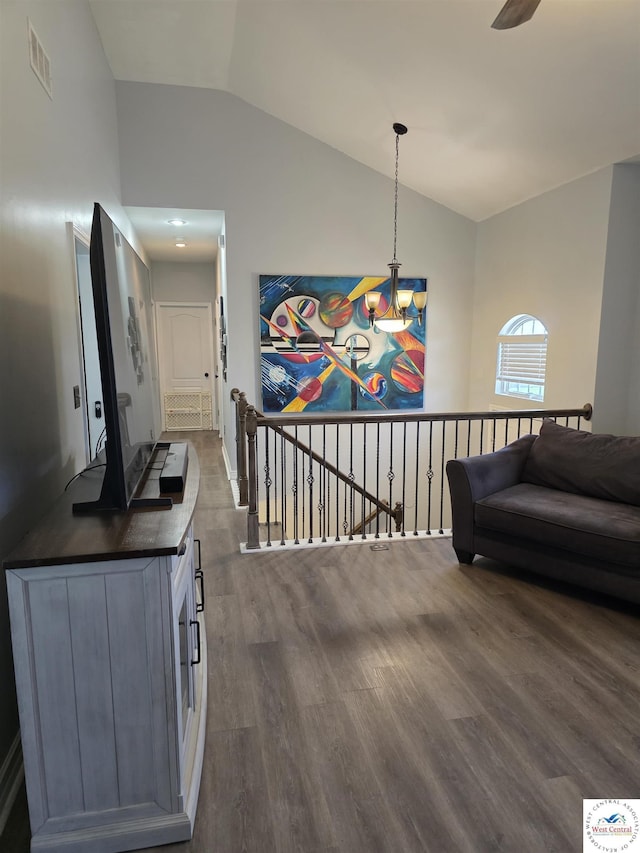 1010 NW Scenic Dr, Grain Valley, MO 64029 - hall with lofted ceiling, dark wood-style floors, and an upstairs landing