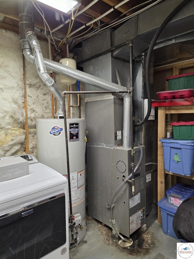 1010 NW Scenic Dr, Grain Valley, MO 64029 - utility room with washer / clothes dryer and gas water heater