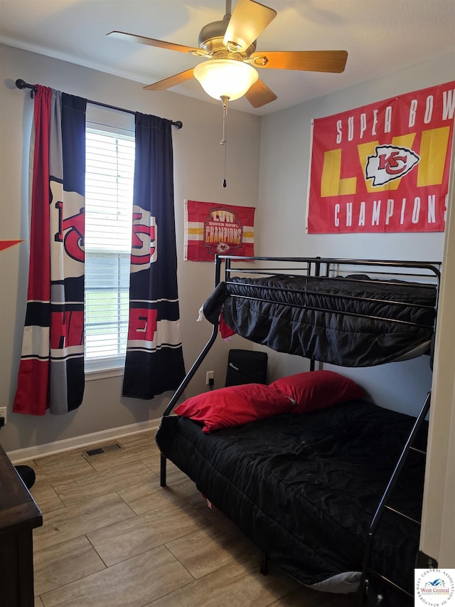 1010 NW Scenic Dr, Grain Valley, MO 64029 - bedroom featuring multiple windows, wood finished floors, and ceiling fan