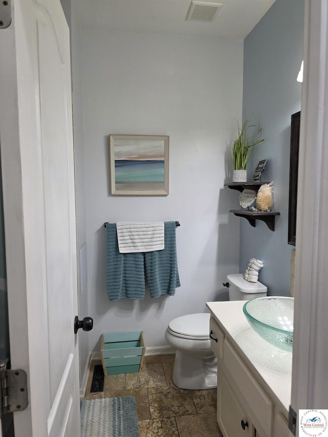 1010 NW Scenic Dr, Grain Valley, MO 64029 - bathroom with stone tile flooring and vanity