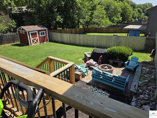 1010 NW Scenic Dr, Grain Valley, MO 64029 - fenced backyard with a fire pit, a storage shed, and a patio area