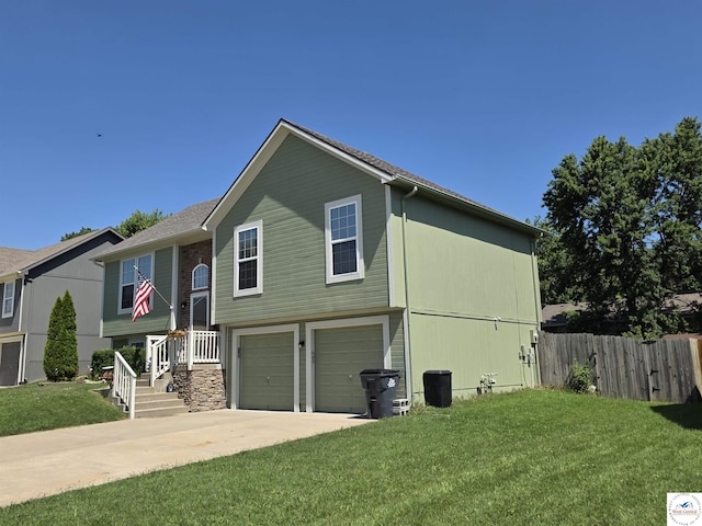 1010 NW Scenic Dr, Grain Valley, MO 64029 - view of front of house with an attached garage and concrete driveway