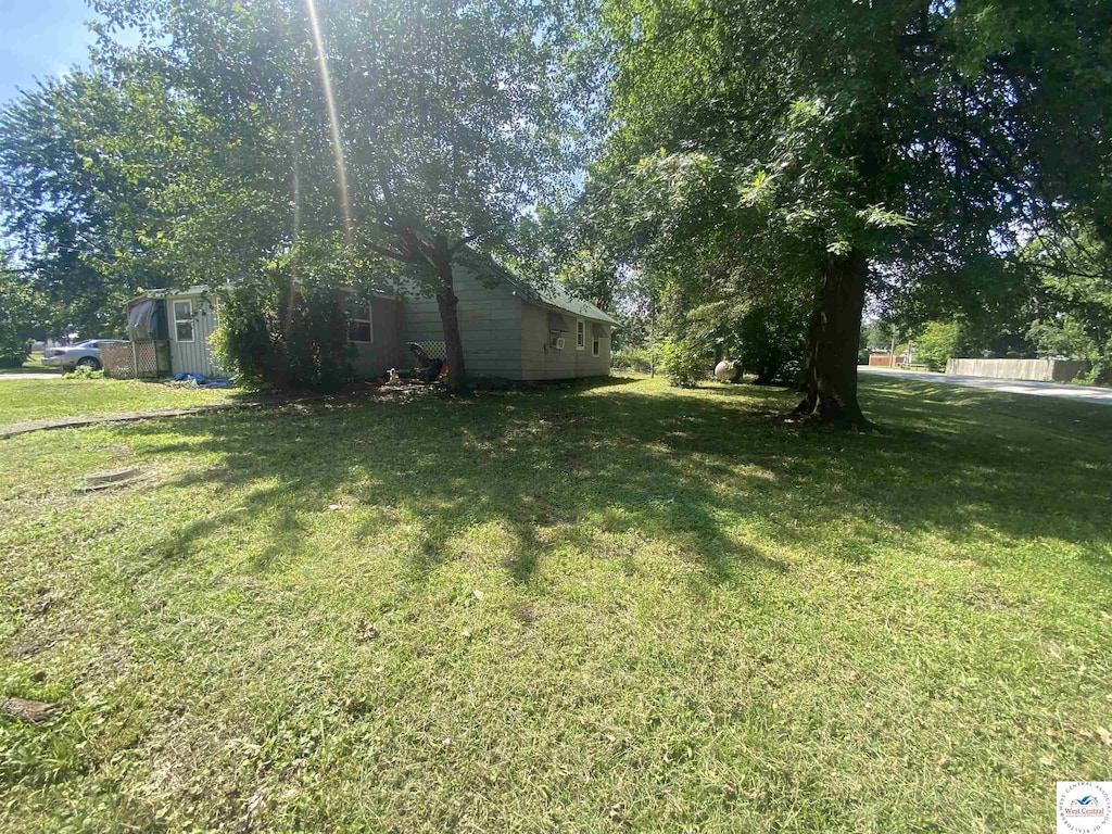 207 W 2nd St, Lowry City, MO 64763 - view of green lawn