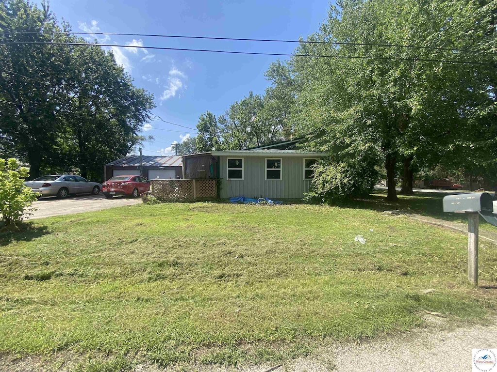 207 W 2nd St, Lowry City, MO 64763 - view of front of home featuring a front yard