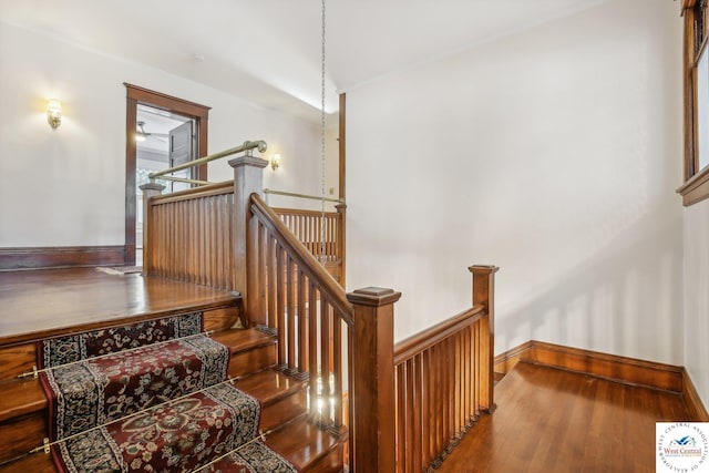 503 S 2nd St, Clinton, MO 64735 - staircase featuring wood finished floors and baseboards
