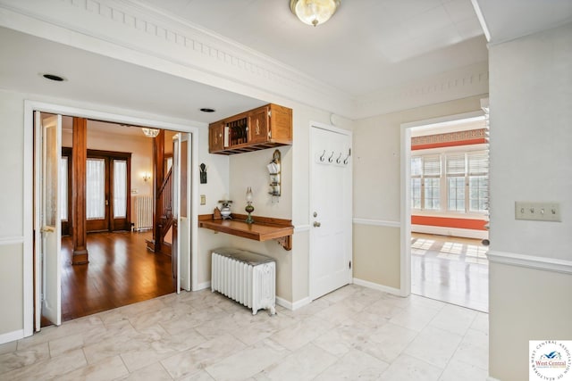 503 S 2nd St, Clinton, MO 64735 - kitchen with radiator heating unit, light marble finish floors, and baseboards