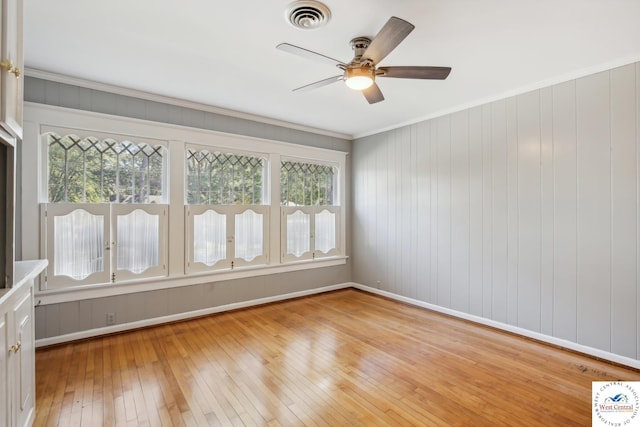503 S 2nd St, Clinton, MO 64735 - unfurnished room featuring light wood-style floors, a ceiling fan, ornamental molding, and baseboards