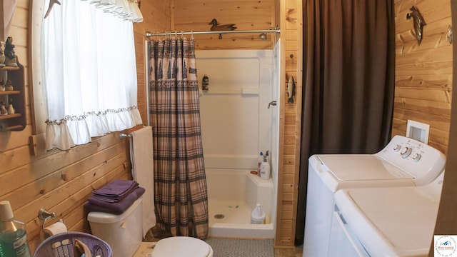 29139 Sandy Ln, Lincoln, MO 65338 - bathroom featuring separate washer and dryer, wooden walls, and a stall shower