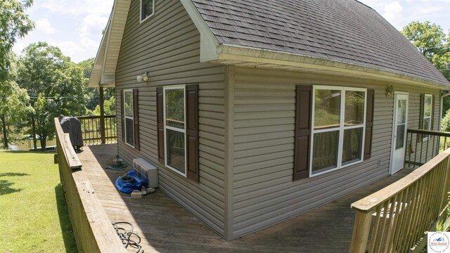29139 Sandy Ln, Lincoln, MO 65338 - view of home's exterior featuring roof with shingles, a wooden deck, and a lawn