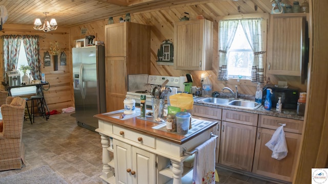 29139 Sandy Ln, Lincoln, MO 65338 - kitchen with stainless steel fridge, white range with electric cooktop, wooden walls, open shelves, and a chandelier