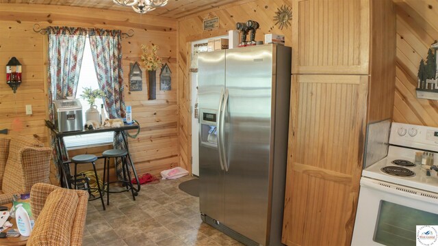 29139 Sandy Ln, Lincoln, MO 65338 - kitchen with stainless steel fridge with ice dispenser, white range with electric cooktop, wood walls, and a chandelier