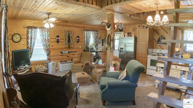 29139 Sandy Ln, Lincoln, MO 65338 - living area featuring wood walls, a chandelier, wood ceiling, and a ceiling fan
