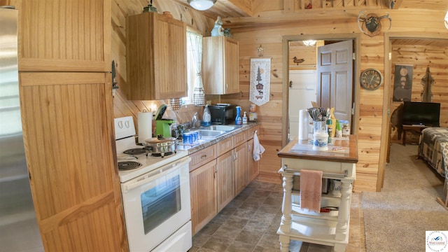 29139 Sandy Ln, Lincoln, MO 65338 - kitchen featuring white range with electric stovetop, wooden walls, light brown cabinetry, stainless steel fridge, and light countertops