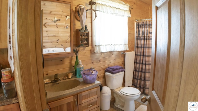 29139 Sandy Ln, Lincoln, MO 65338 - bathroom featuring vanity, a shower with curtain, and wood walls