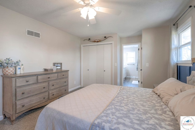 bedroom with a ceiling fan, visible vents, a closet, and baseboards