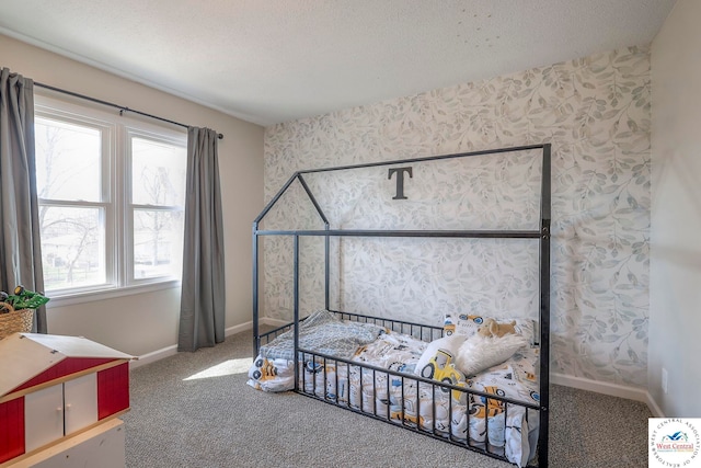bedroom featuring baseboards, wallpapered walls, a textured ceiling, and carpet