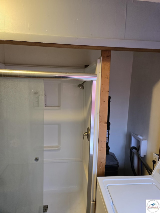 laundry room with laundry area and washer / clothes dryer