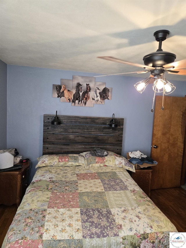 bedroom featuring a ceiling fan and wood finished floors