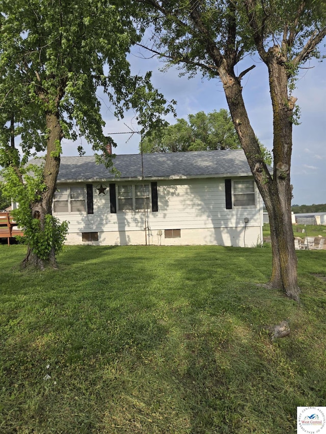 single story home with a front lawn and a chimney