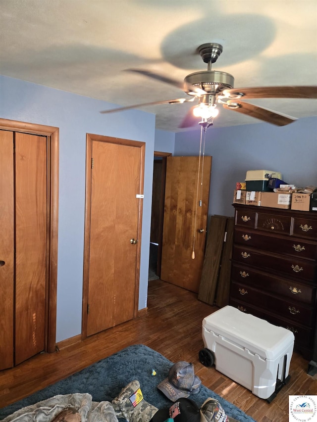bedroom with ceiling fan and wood finished floors