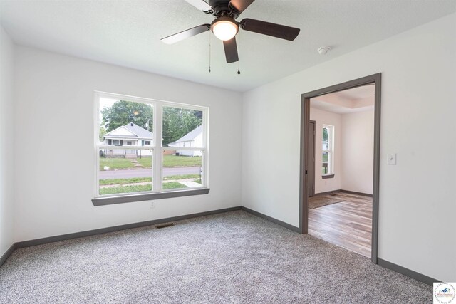 704 E 16th St, Sedalia, MO 65301 - carpeted spare room featuring plenty of natural light, baseboards, and ceiling fan