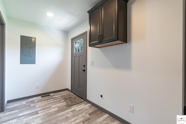 704 E 16th St, Sedalia, MO 65301 - entryway featuring electric panel, light wood finished floors, baseboards, and recessed lighting