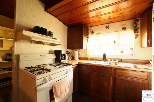 21609 Valley Rd, Warsaw, MO 65355 - kitchen featuring light countertops, under cabinet range hood, white range with gas cooktop, and a sink