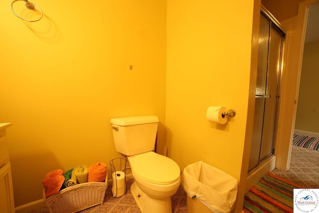 21609 Valley Rd, Warsaw, MO 65355 - full bathroom featuring a stall shower, toilet, and vanity