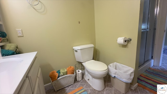 21609 Valley Rd, Warsaw, MO 65355 - bathroom with an enclosed shower, toilet, vanity, and baseboards