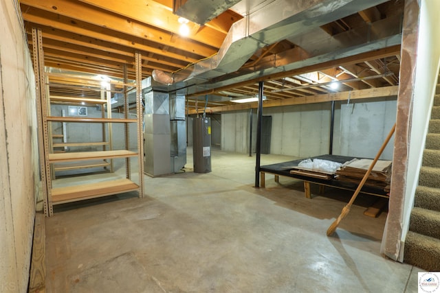 3375 Cedar St, Sedalia, MO 65301 - unfinished basement featuring water heater, stairway, and heating unit