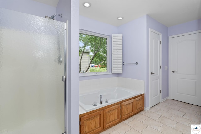 3375 Cedar St, Sedalia, MO 65301 - bathroom with a shower stall, a garden tub, tile patterned flooring, and recessed lighting