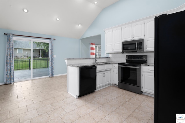 3375 Cedar St, Sedalia, MO 65301 - kitchen with black appliances, a peninsula, lofted ceiling, white cabinets, and light stone counters