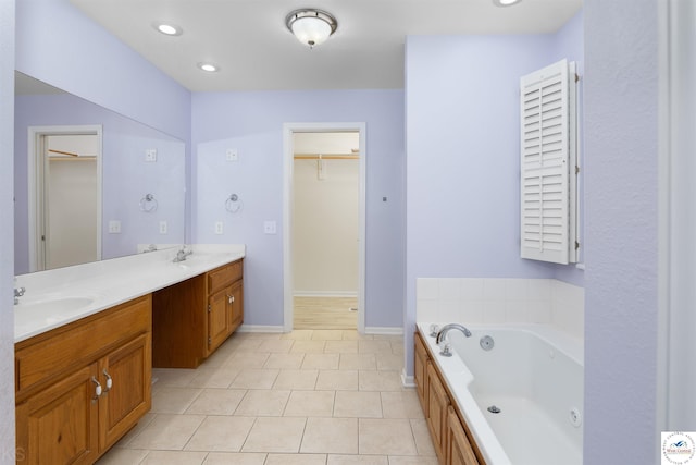 3375 Cedar St, Sedalia, MO 65301 - full bath featuring a whirlpool tub, double vanity, a walk in closet, tile patterned flooring, and recessed lighting