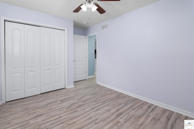 3375 Cedar St, Sedalia, MO 65301 - unfurnished bedroom with light wood-style floors, a closet, and a ceiling fan