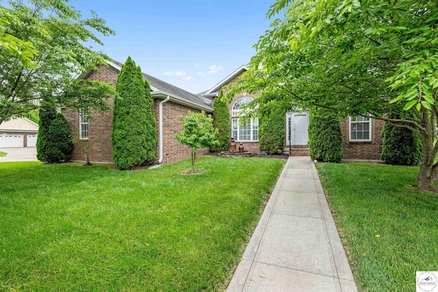3375 Cedar St, Sedalia, MO 65301 - obstructed view of property with brick siding and a front yard