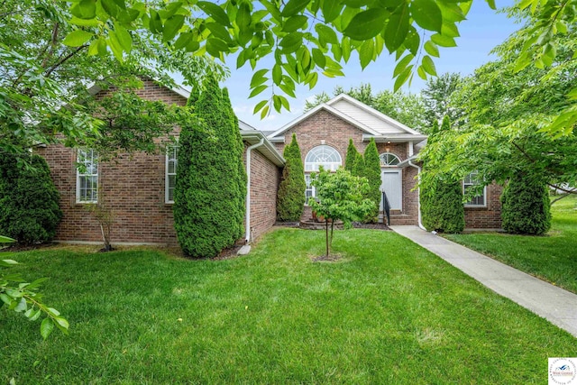 3375 Cedar St, Sedalia, MO 65301 - view of front of property with a front lawn and brick siding