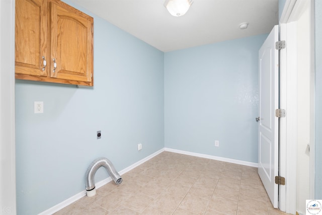 3375 Cedar St, Sedalia, MO 65301 - laundry room with cabinet space, electric dryer hookup, and light tile patterned floors