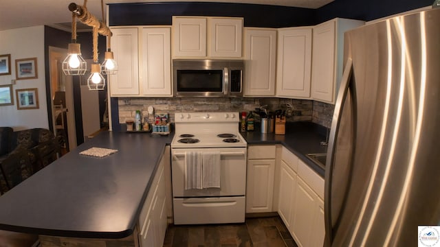 29781 Lake Road 57 Rd, Warsaw, MO 65355 - kitchen with decorative backsplash, stainless steel appliances, dark countertops, and white cabinetry