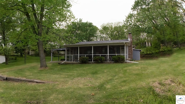 29781 Lake Road 57 Rd, Warsaw, MO 65355 - back of property featuring a yard, a chimney, and a sunroom