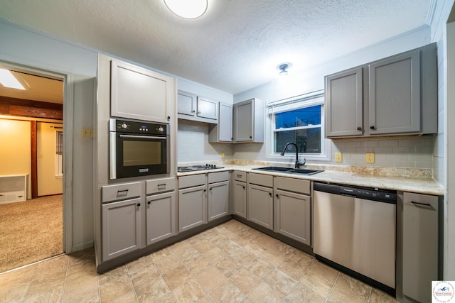 1315 Maple Ln, Sedalia, MO 65301 - kitchen featuring gray cabinets, light countertops, oven, dishwasher, and a sink