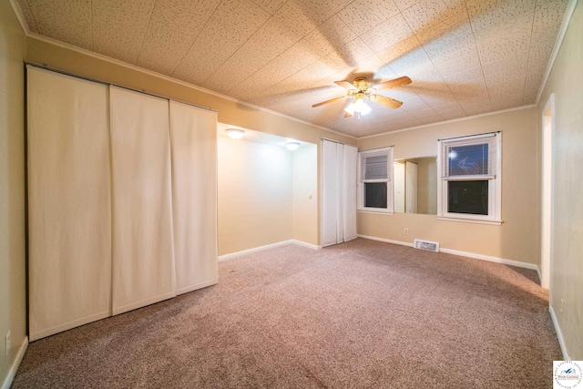 1315 Maple Ln, Sedalia, MO 65301 - empty room featuring visible vents, ceiling fan, carpet, and crown molding