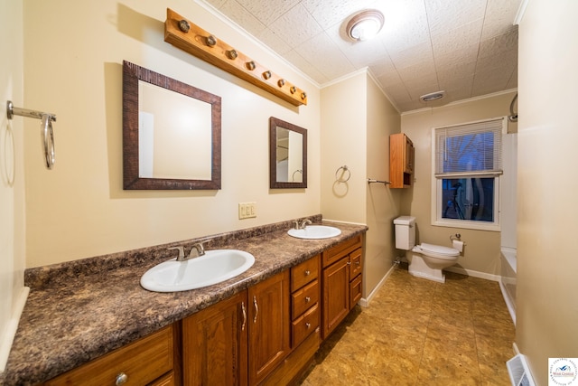 1315 Maple Ln, Sedalia, MO 65301 - bathroom featuring toilet, double vanity, a sink, and ornamental molding