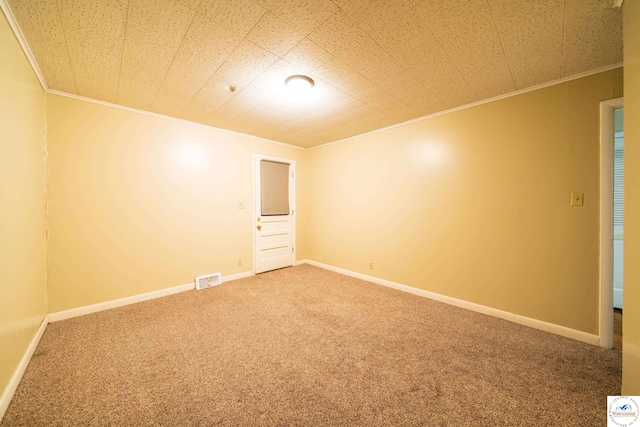 1315 Maple Ln, Sedalia, MO 65301 - spare room featuring ornamental molding, visible vents, carpet floors, and baseboards