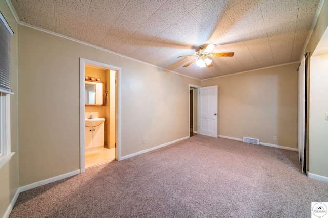 1315 Maple Ln, Sedalia, MO 65301 - unfurnished bedroom with ensuite bath, crown molding, visible vents, baseboards, and carpet floors