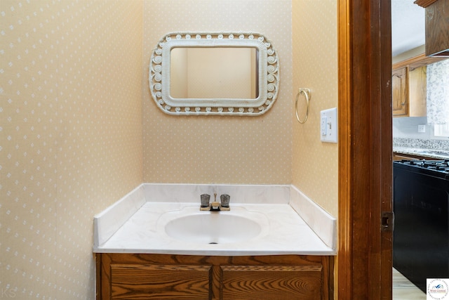 5900 Apple Rd, Sedalia, MO 65301 - bathroom with vanity and wallpapered walls
